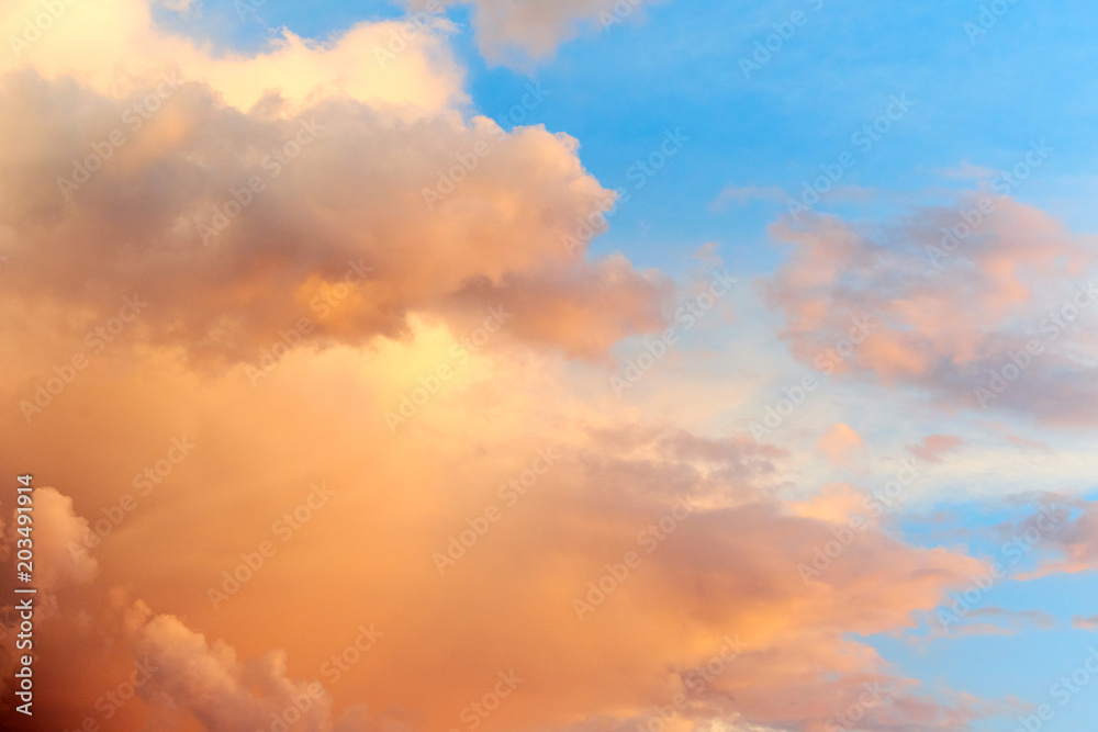 Beautiful sky background with orange colored clouds. Beautiful orange color in clouds