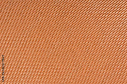 Striped embossed brown paper. Bronze paper texture background