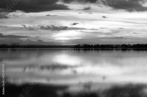 Perfectly symmetric reflection of sunset on a lake