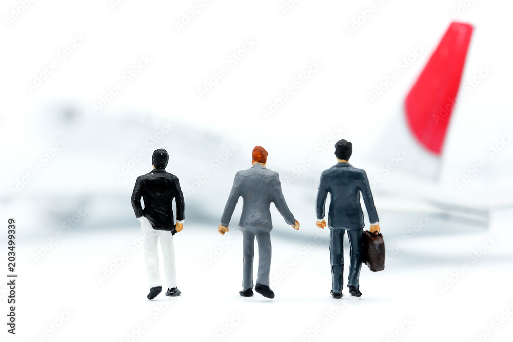 Miniature people : business with air plane using for business trip concept. Miniature people : business with air plane using for business trip concept.