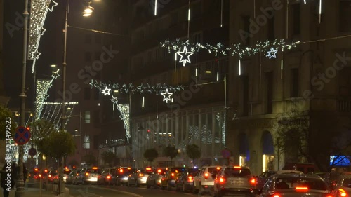 Cars on a decorated street at ninght photo