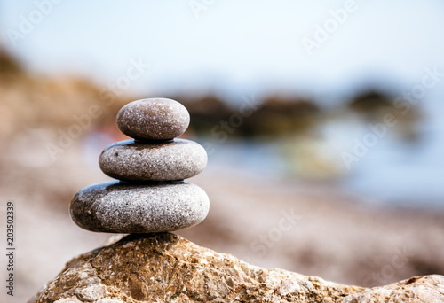 Stones balance  pebbles stack over blue sea. Picturesque and gorgeous scene.