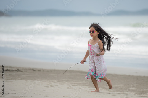 Children walking on the beach