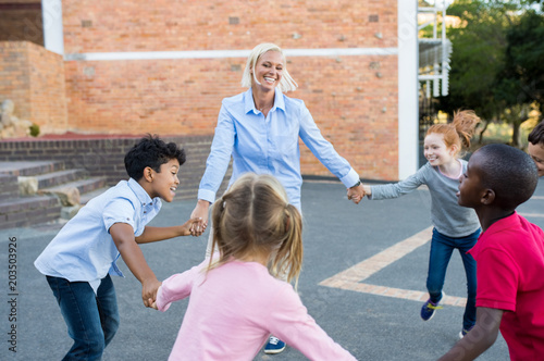 Children and teacher playing together