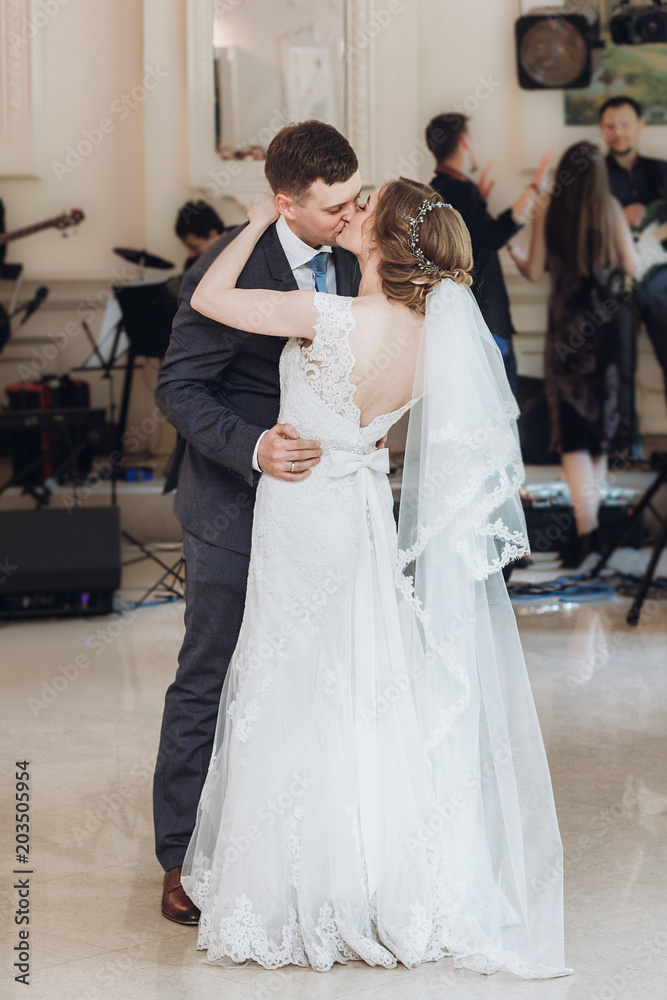 beautiful gorgeous bride and groom performing first dance. happy wedding couple dancing in restaurant at wedding reception. happy marriage moments. elopement concept