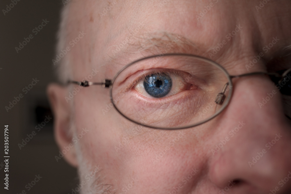 Close up of adult male with glasses Close up of adult male with glasses