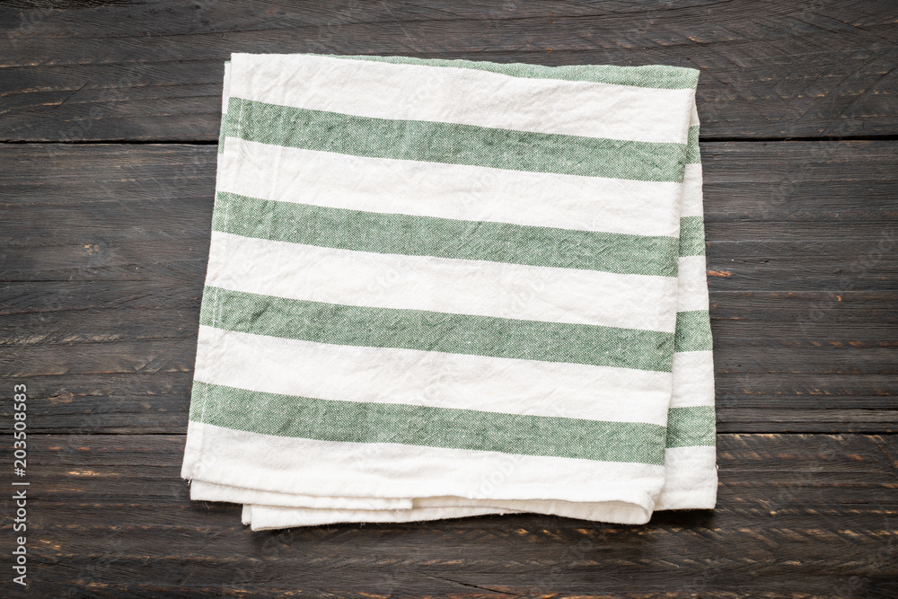 kitchen cloth (napkin) on wood background kitchen cloth (napkin) on wood background