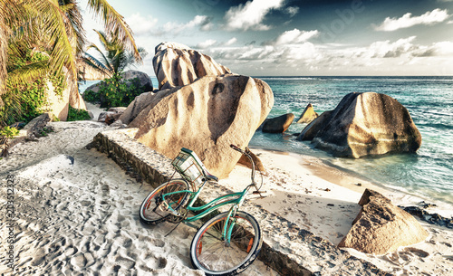 Bike parked on a beautiful tropical beach. Holiday concept