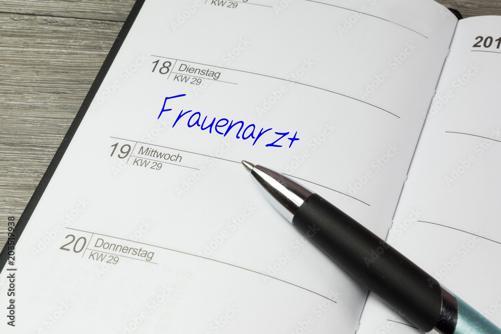 Ein Terminkalender und Erinnerung an ein Termin beim Frauenarzt Ein Terminkalender und Erinnerung an ein Termin beim Frauenarzt