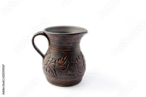 Ceramic jug with a handle, dark brown with a crushed pattern on a white background.