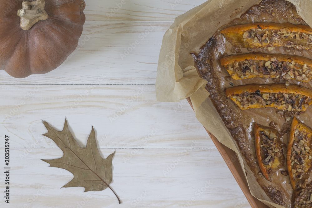 Fototapeta premium Authentic view of a pumpkin baked with slices of honey and walnuts