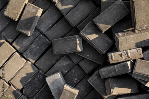 Concrete paving slabs. Background of free unpaid paves