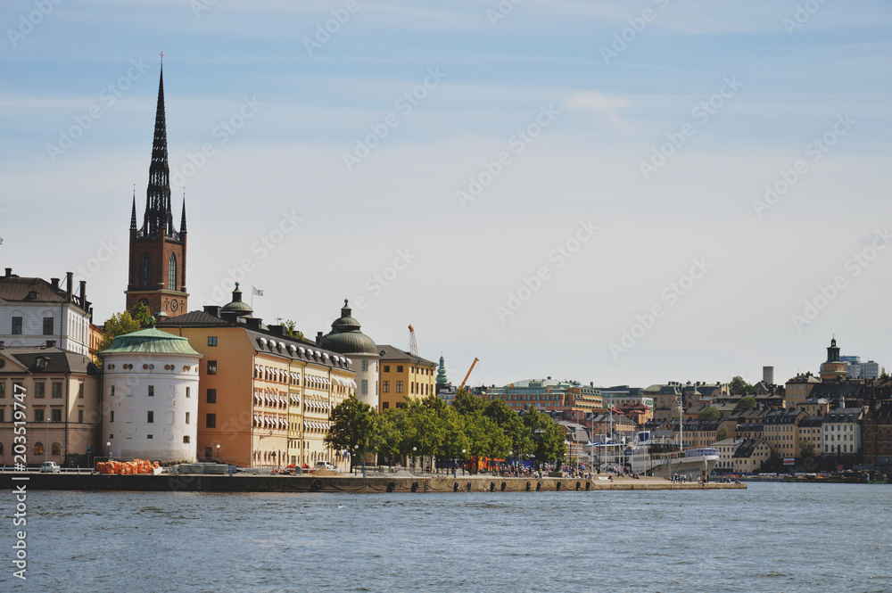 Fototapeta premium Cityscape view of Stockholm’s old town in famous Gamla Stan area densely situated by archaic buildings influenced by North German architecture