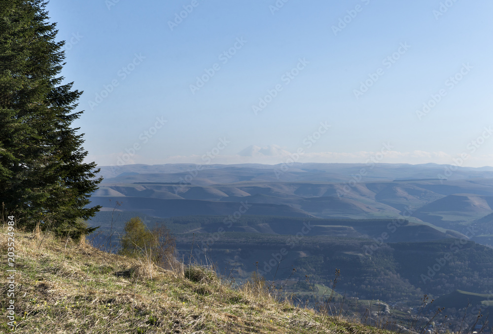 view of mountain valley, mount Elbrus on the horizon, North Caucasus view of mountain valley, mount Elbrus on the horizon, North Caucasus