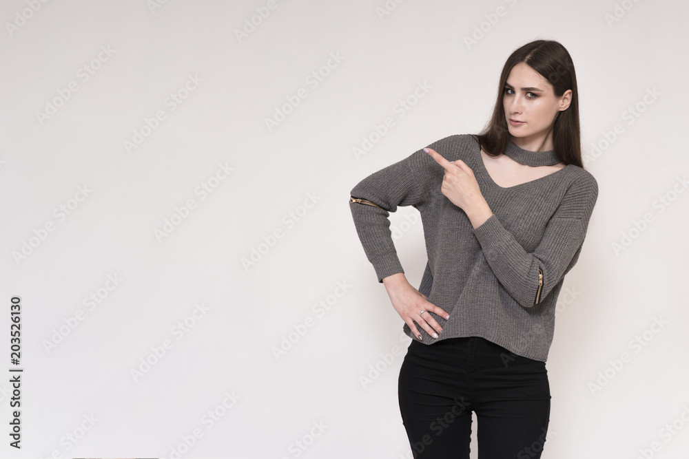 Beautiful brunette girl on a white background showing hands Beautiful brunette girl on a white background showing hands