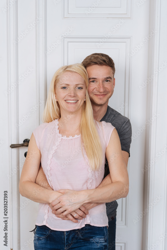 Home portrait of young smiling couple Home portrait of young smiling couple