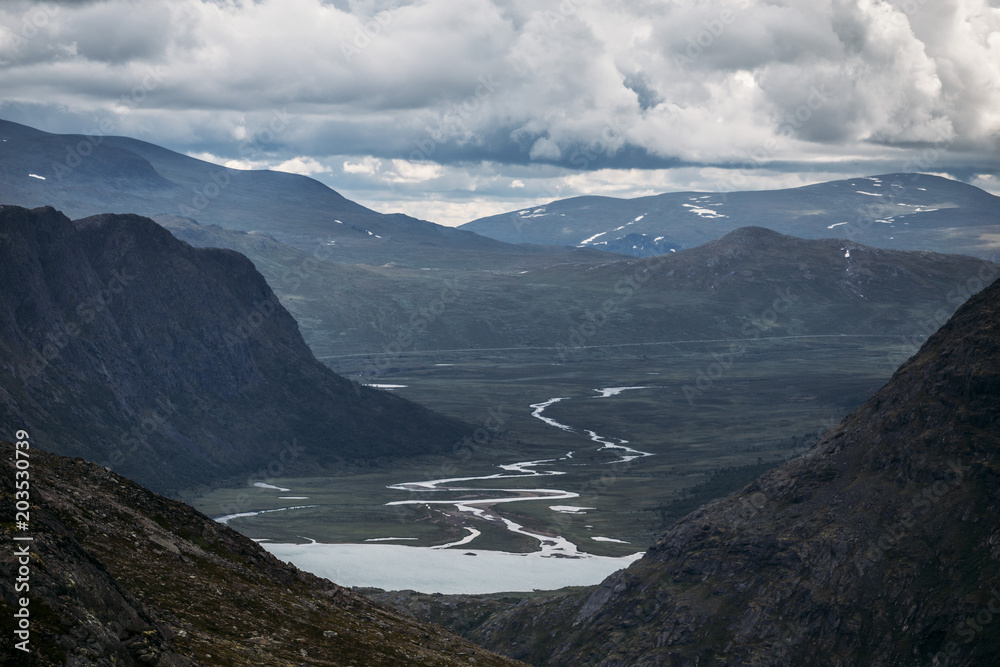A river valley Between mountains in Norway