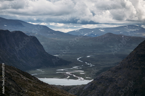 A river valley Between mountains in Norway