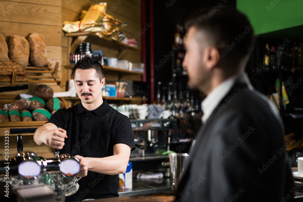 Male barista and his friend