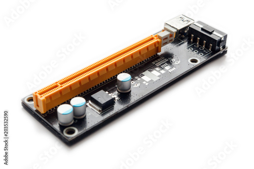 Adapter or riser PCI-E for mining on video cards. Device for adaptation 1X PCI-E to 16X slot and add video graphic cards to motherboard. Closeup on white background.