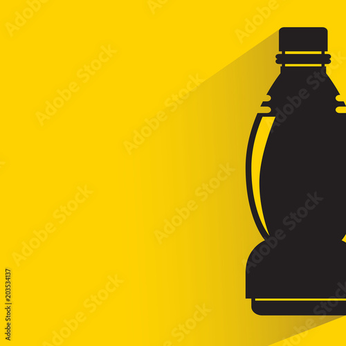 beverage bottle with drop shadow on yellow background