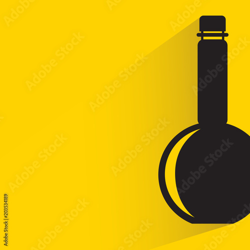 beverage bottle with drop shadow on yellow background
