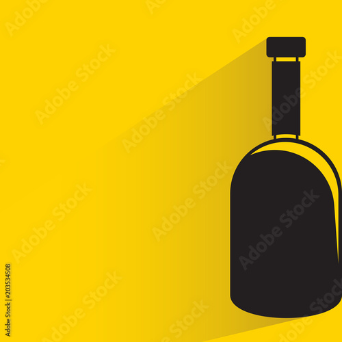 beverage bottle with drop shadow on yellow background