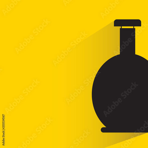 beverage bottle with drop shadow on yellow background