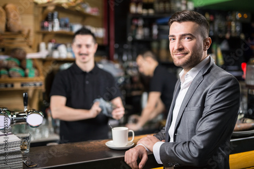 Happy guest in coffee shop