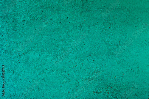Texture of the concrete surface, painted in turquoise.