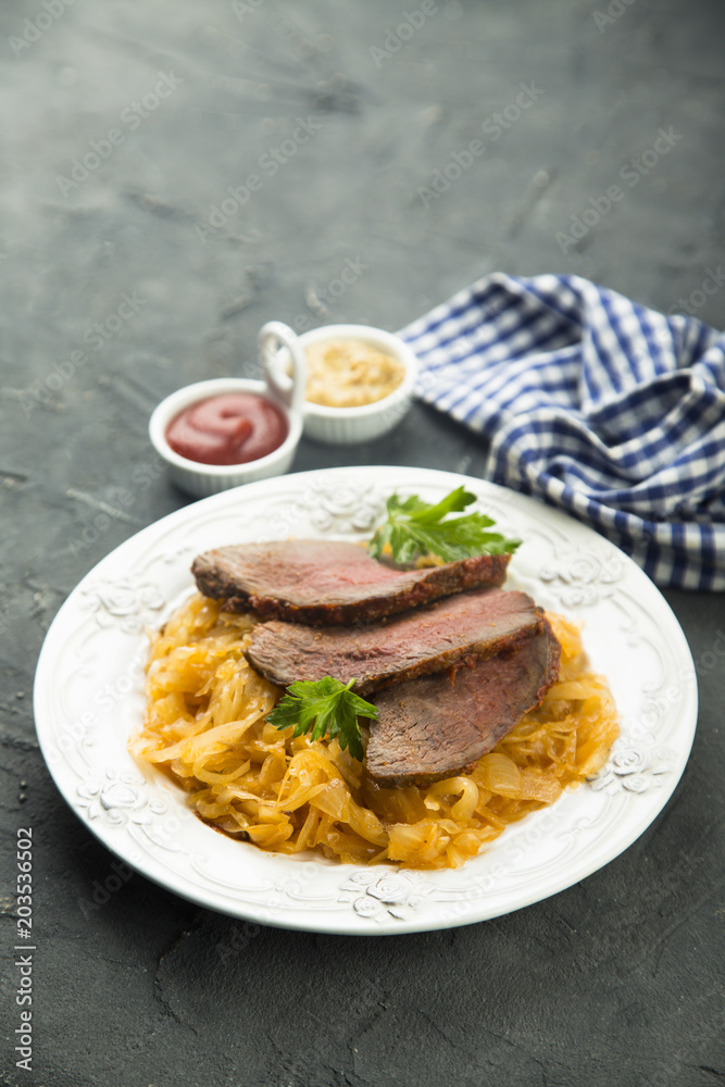 Beef fillet serves with sauerkraut