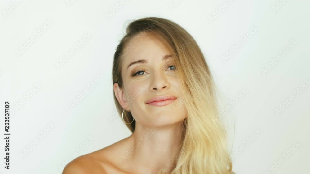 Sexy woman touching long hair and posing front camera close up Sexy woman touching long hair and posing front camera close up