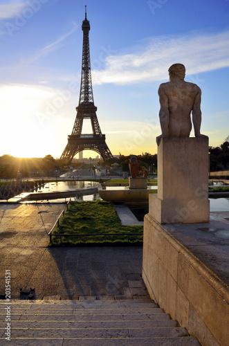 Eiffel tower. Paris. France. Statue and sunrise.