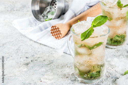 Slika na platnu Cold summer beverage, mint julep cocktail drink, grey stone background copy spac
