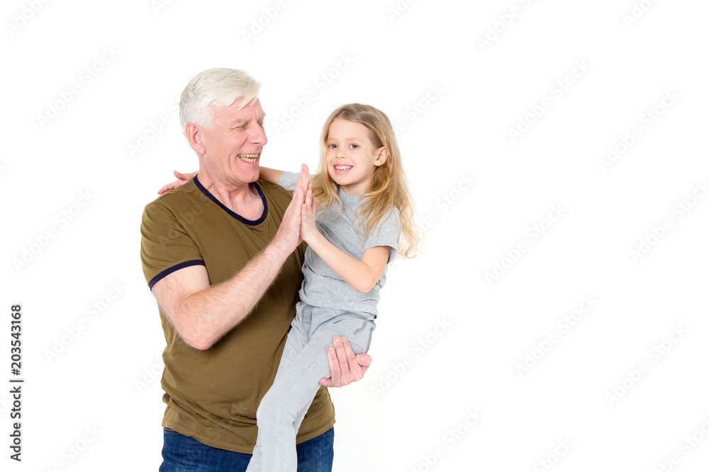 Man with a little girl. Father and daughter. Granddaughter and grandfather. A happy family. Man with a little girl. Father and daughter. Granddaughter and grandfather. A happy family.