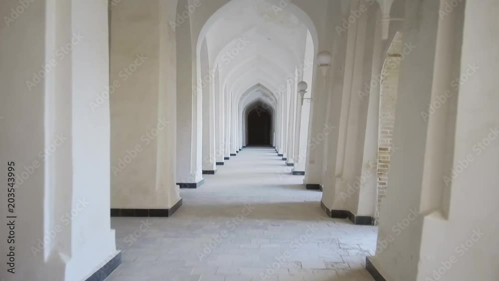 Arched hallway perspective at Mir-i-Arab medressa in Bukhara, Uzbekisan. Arched hallway perspective at Mir-i-Arab medressa in Bukhara, Uzbekisan.