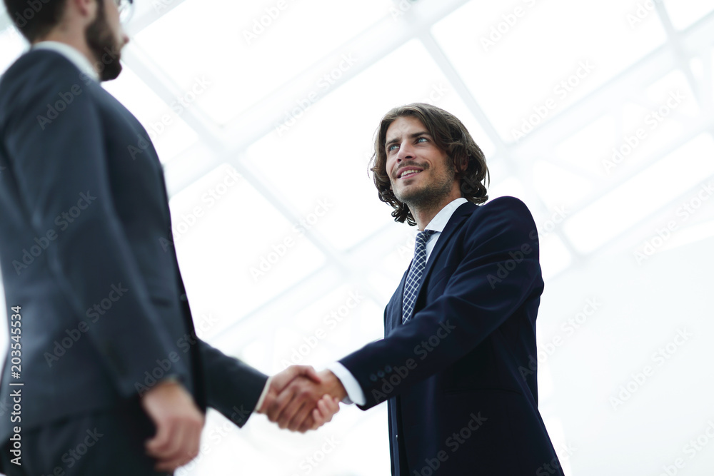 Close up image of business handshake at meeting. Close up image of business handshake at meeting.