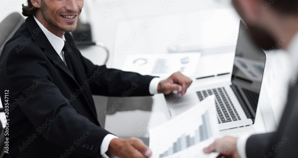 employee gives the Manager the financial report employee gives the Manager the financial report