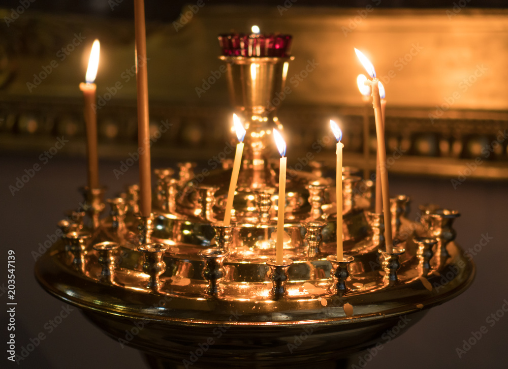 Fototapeta premium Metal candle light cresset in church.