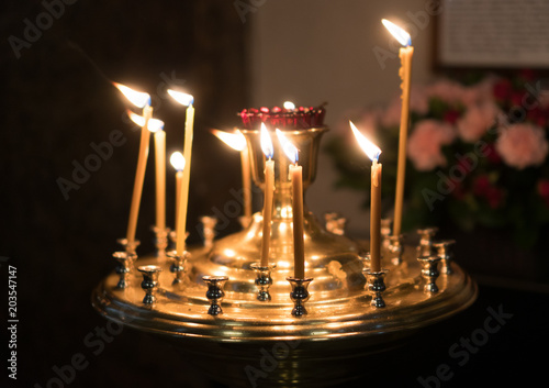 Metal candle light cresset in church.