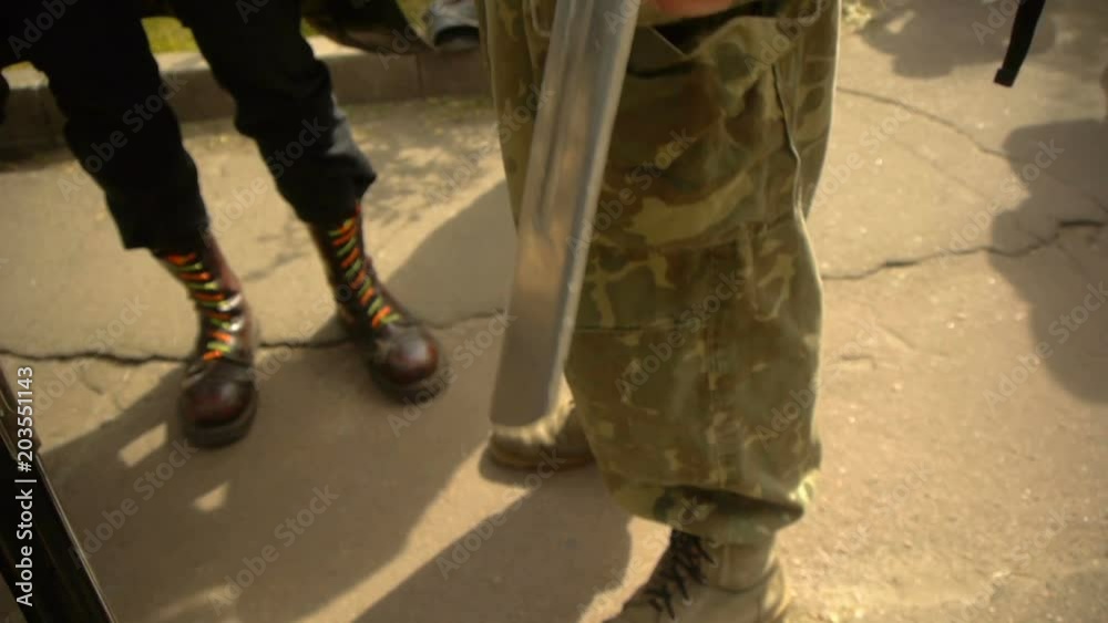 A guy with a sword blade tied to his hand, street hooligans A guy with a sword blade tied to his hand, street hooligans