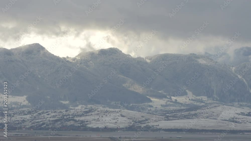 Forested mountains seen on a winter day Forested mountains seen on a winter day