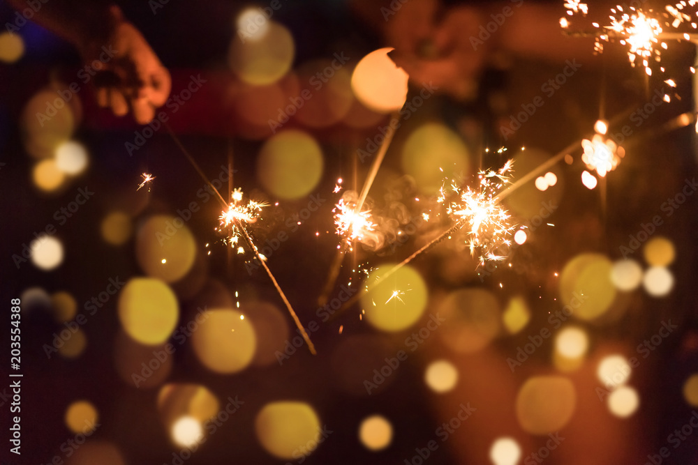 Abstract blurred of Sparklers with group of friends having fun for