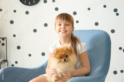 Cute girl with little dog i...