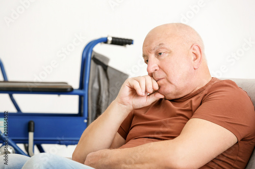 Lonely elderly man sitting ...