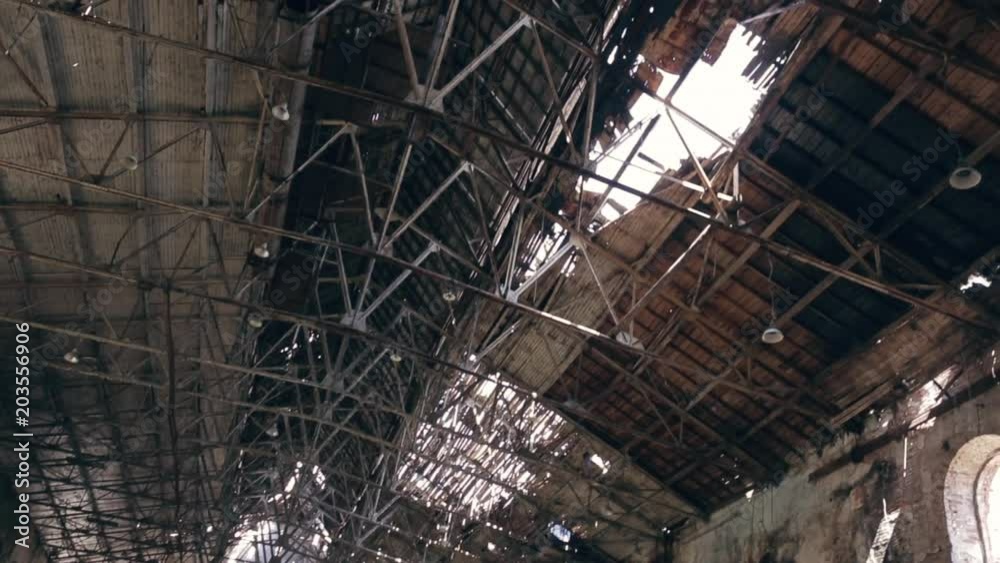 large ruined and demolished abandoned factory hangar or warehouse, post apocalyptic disaster concept, toned large ruined and demolished abandoned factory hangar or warehouse, post apocalyptic disaster concept, toned