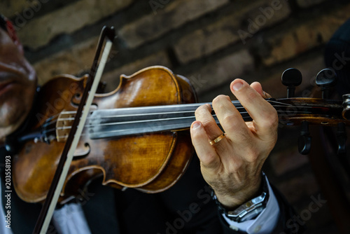 Violinist playing in small presentation. The violin is one of the instruments that represent orchestras and classical music.