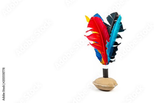 Handmade shuttlecock toy with colourful feathers on white background photo