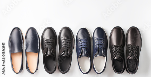 Several men's pair of shoes on white background