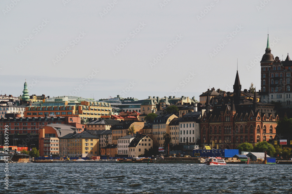 Fototapeta premium Cityscape view of Stockholm’s old town in famous Gamla Stan area densely situated by archaic buildings influenced by North German architecture